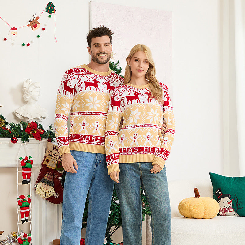Parent child matching christmas sweater worn by family holiday photo