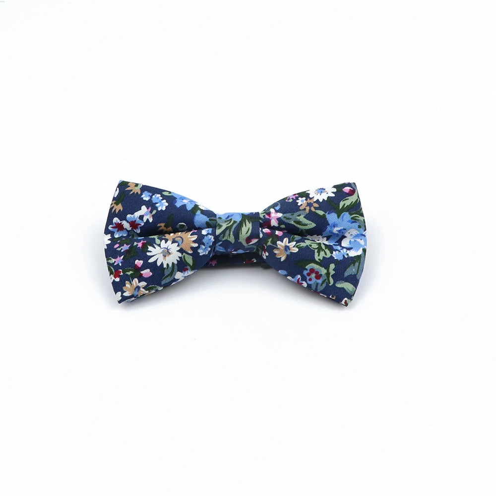 Shop this family matching bow tie set in floral cotton. Fits kids, adults, and pets. Perfect for parties, dinners, holidays, and family photo occasions.