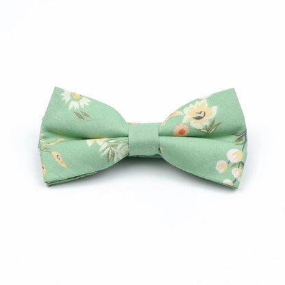 Family matching bow tie set sizes for kids adults and pets flat lay